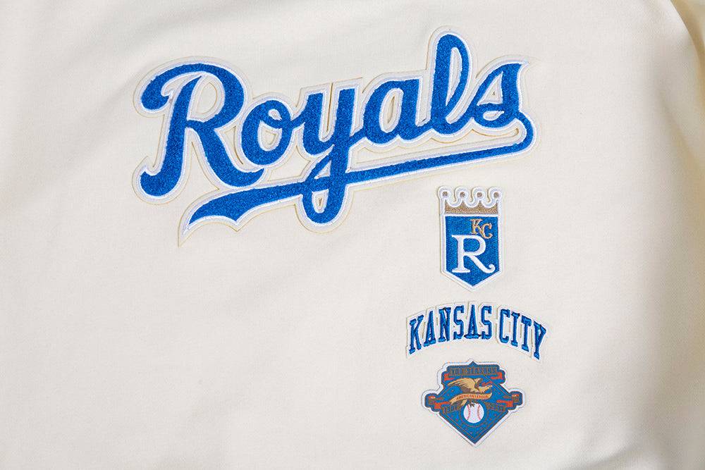 SUÉTER DE CUELLO REDONDO RETRO CLÁSICO PARA MUJER MLB KANSAS CITY ROYALS (BLANCO HUESO/ AZUL UNIVERSITARIO)